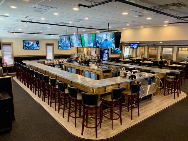 The bar and dining room at D'Ann's with TVs above