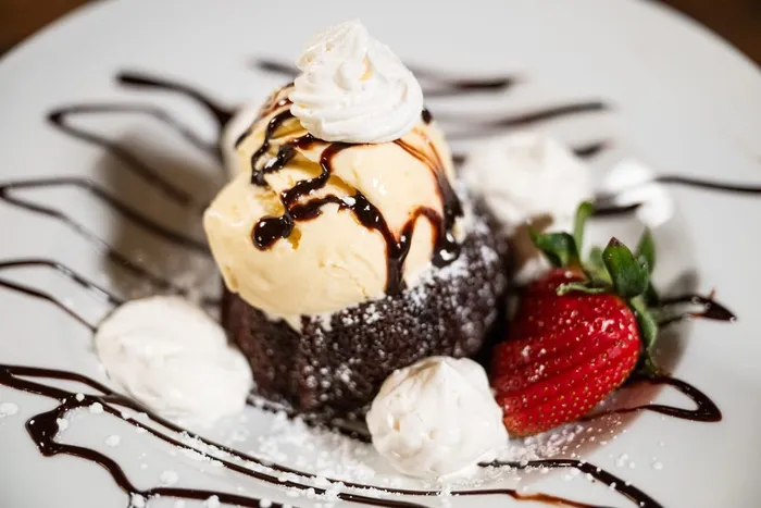 Molten lava cake with ice cream and strawberry